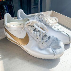 NIKE white with gold swoosh